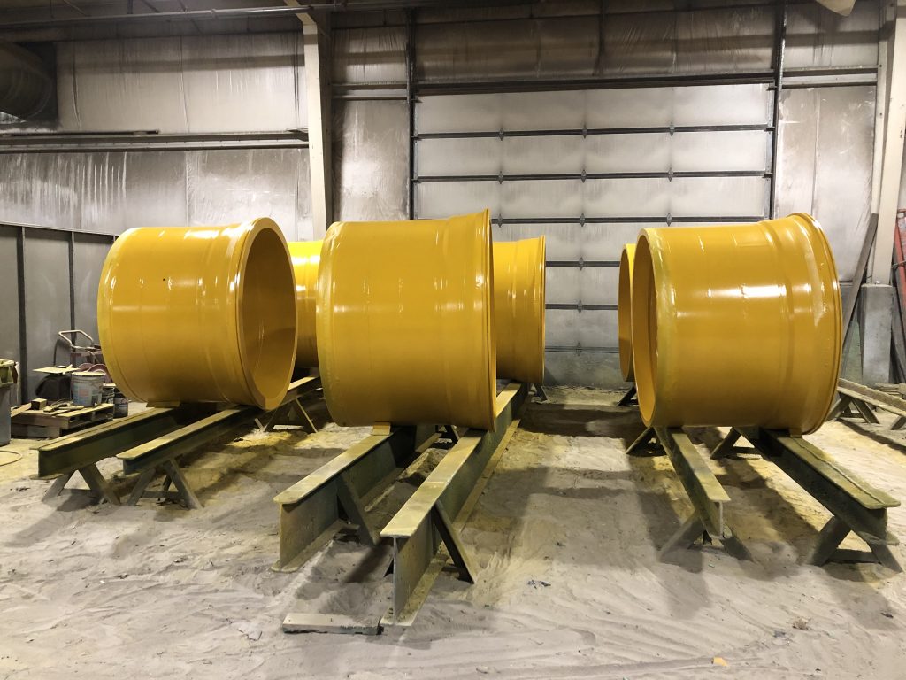 Coated metal parts in golden yellow industrial finish